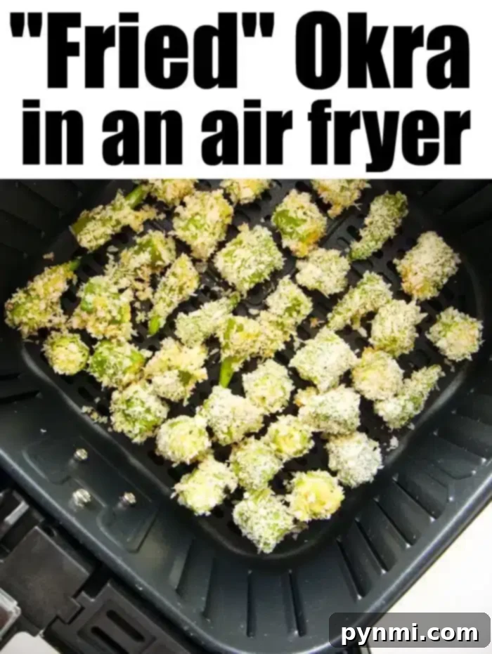 Crispy Air fryer okra is so good! Crispy breadcrumbs coating on the outside with tender flavorful vegetable on the inside. Great side dish or low carb snack. Chopped okra perfectly coated in Panko breadcrumbs sits inside the air fryer basket, showcasing how to create delicious fried okra without the mess or excess oil.