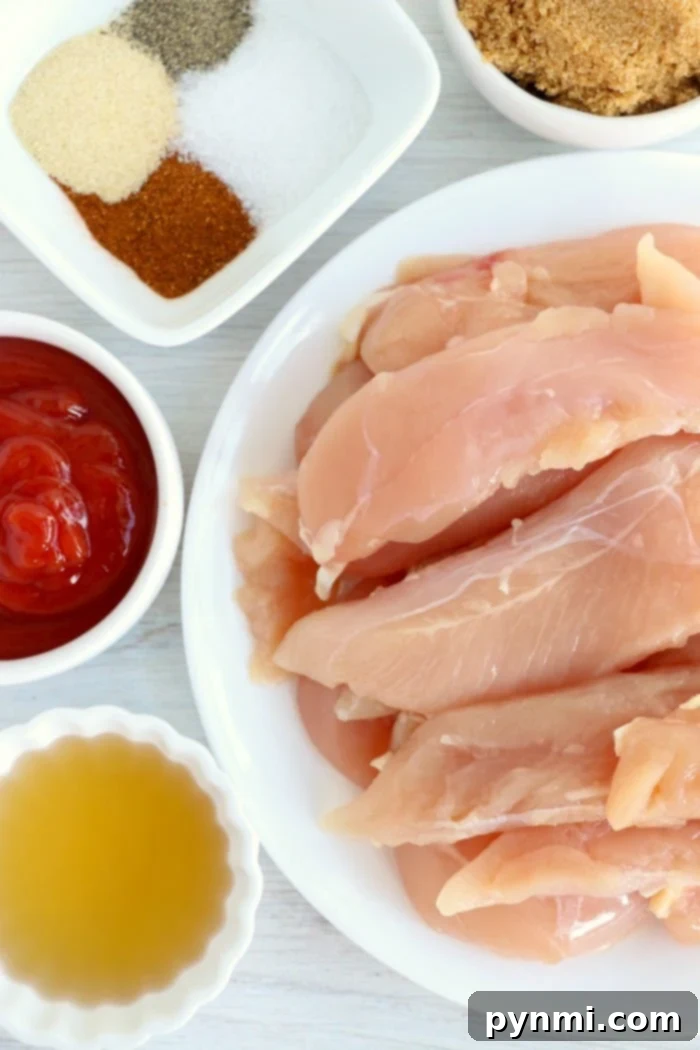Fresh chicken tenders ready for seasoning, illustrating the simple preparation for a no-breading air fryer meal.