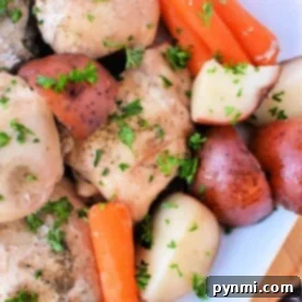 A dish of seasoned chicken thighs with baby carrots, red potatoes, and parsley garnish on a white plate, this instant pot chicken and potatoes recipe offers a quick and delectable meal thats both comforting and effortless.