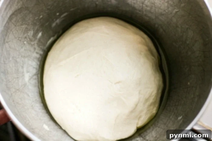 Homemade pretzel dough stretched into ropes for hot dogs