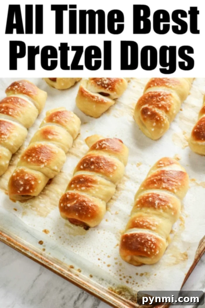 Freshly baked Auntie Anne's style Pretzel Dogs on a serving platter