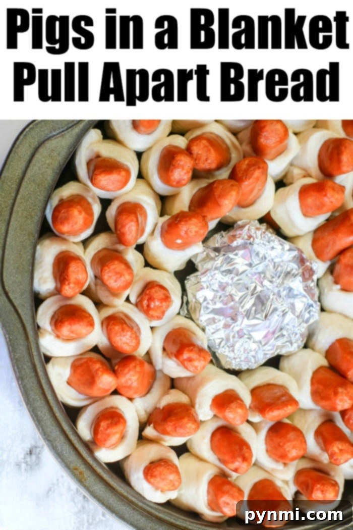 A vibrant close-up of a full platter of pigs in a blanket, artfully arranged and garnished for a party.