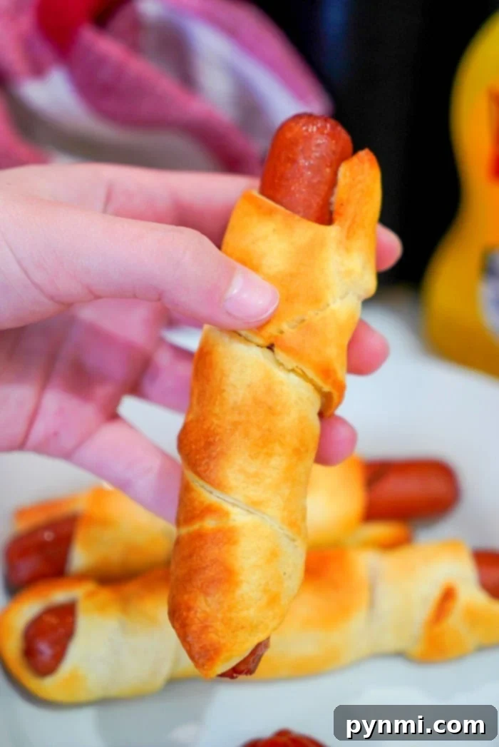 Best air fryer pigs in a blanket are my kids favorite snacks! Easy recipe to make with crescent rolls and hot dogs that turns out crunchy to perfection every time. pigs in a blanket air fryer