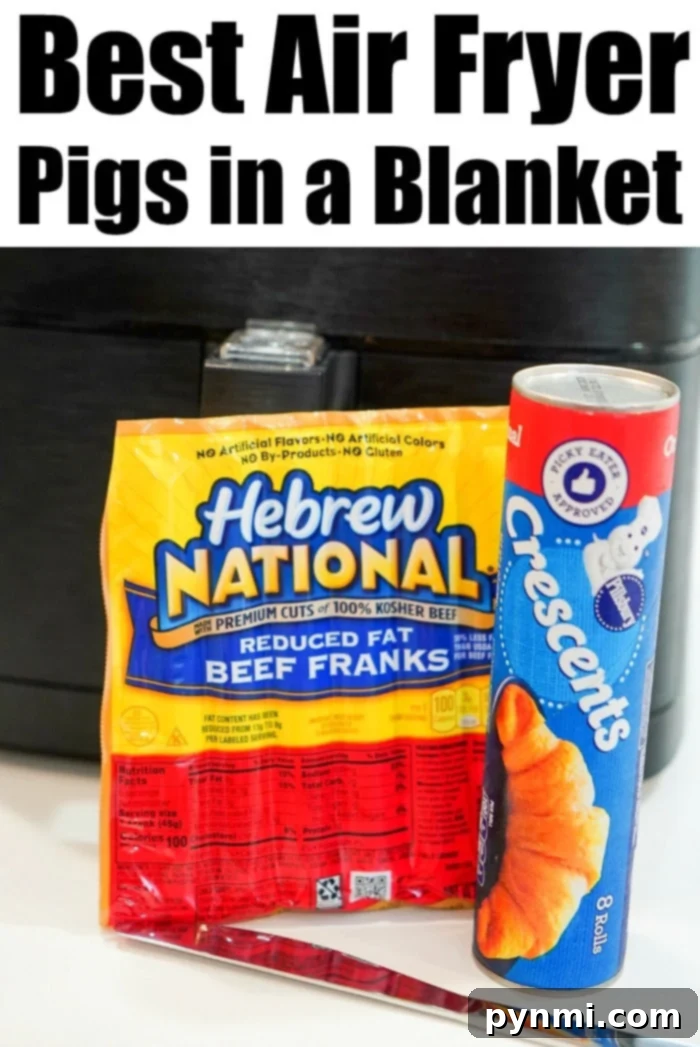 Air fryer pigs in a blanket are my kids favorite snacks! Easy recipe to make with crescent rolls and hot dogs that turns out crunchy to perfection every time. A package of Hebrew National reduced fat beef franks sits beside a can of Pillsbury Crescent rolls. In the background, a black air fryer awaits as a silver pair of tongs rests in front. Text at the top delightfully proclaims: Best Air Fryer Pigs in a Blanket.
