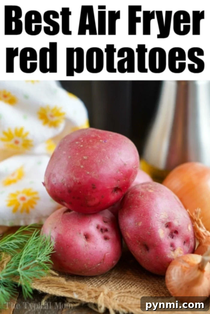 A bowl of air-fried red potatoes with dill and garlic, showing their crispy texture.