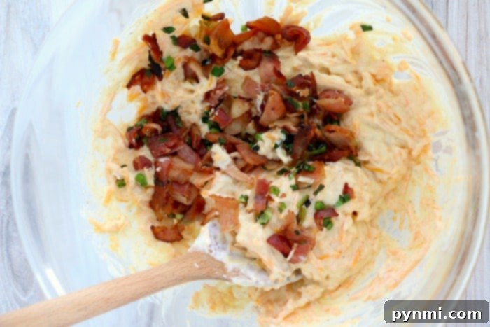 A baking dish filled with a creamy, golden potato bake, fresh out of the oven.