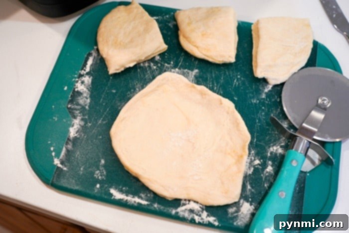 Cooked homemade flour tortillas stacked on a plate, ready to serve.