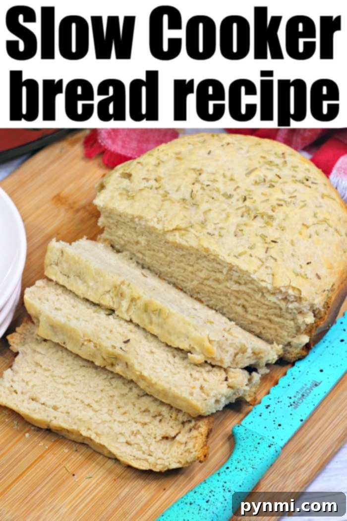 Rosemary slow cooker bread: a simple, delicious Crockpot baking method. Freshly baked Rosemary Slow Cooker Bread, golden brown and sliced, ready to serve.