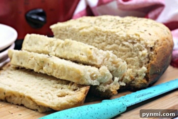 Effortless Slow Cooker Bread 6 A freshly baked, uncut loaf of easy bread recipe in a slow cooker.