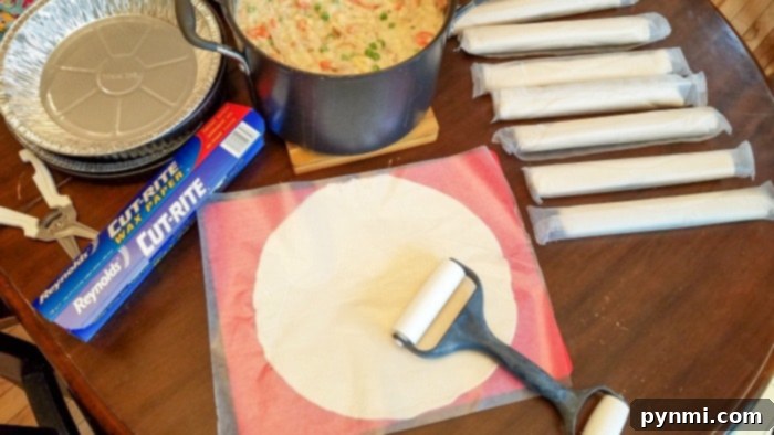 A bottom pie crust carefully placed in a pie dish with excess dough hanging over the edges.