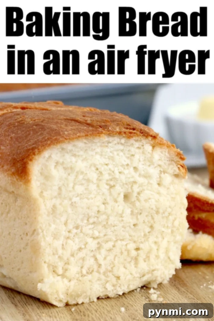 Simple Homemade Air Fryer Bread Recipe Golden brown loaf of easy air fryer bread, sliced and ready to serve.