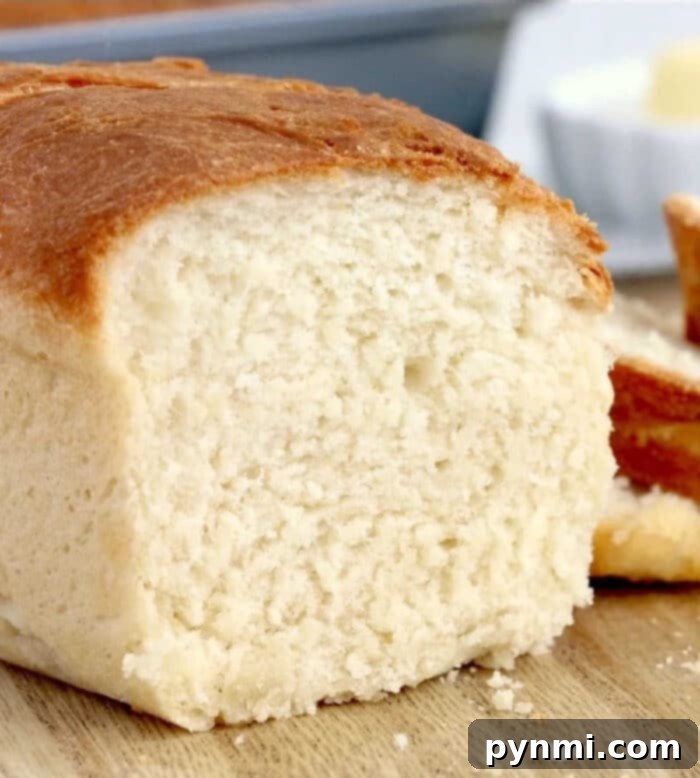 Perfect Homemade Air Fryer Bread 6 Two perfectly baked mini loaves of air fryer bread on a cooling rack.