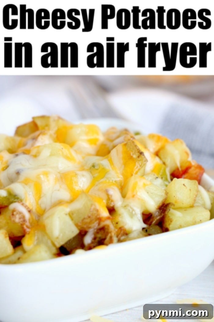 Cheesy air fryer breakfast potatoes with bell peppers topped with cheese are great with eggs, or make breakfast for dinner some night! Cheap and full of flavor. Cheesy air fryer breakfast potatoes with bell peppers, melted cheese, and fresh herbs, presented in a bowl.