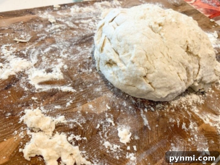 Close-up of freshly prepared Irish soda bread dough, light and pliable, ready for its final shaping before baking.