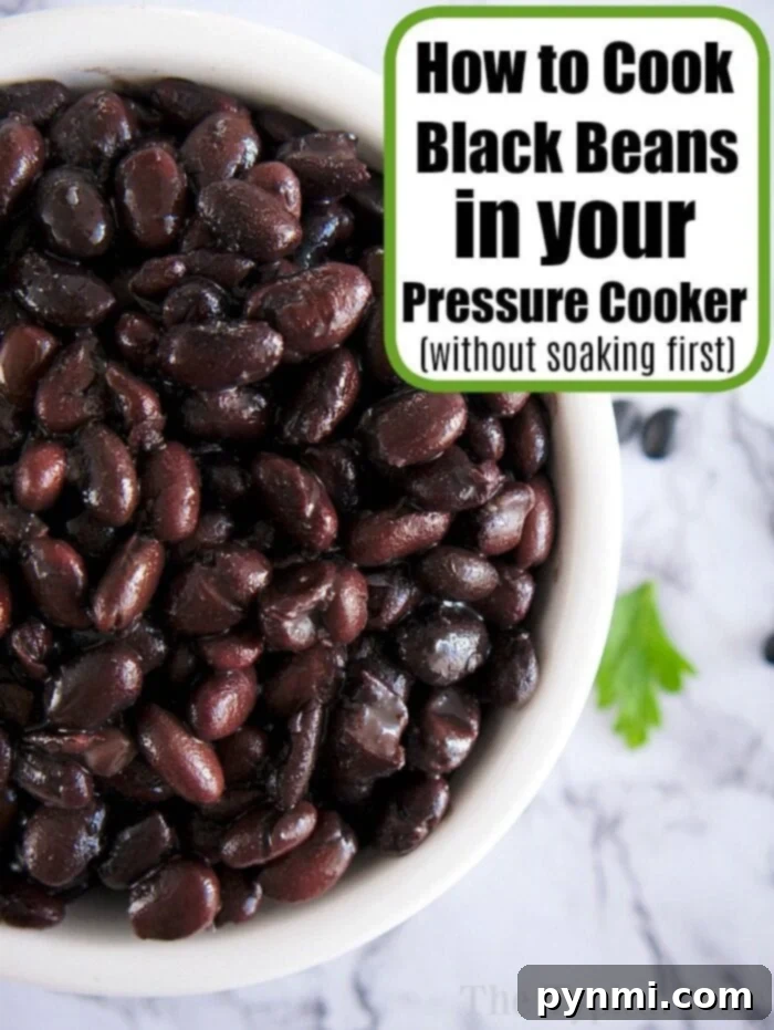 Cook Once, Eat All Week 6 A bowl of cooked black beans rests on a marble surface, perfect for batch cooking. A text overlay reads, "How to Cook Black Beans in your Pressure Cooker (without soaking first)." A sprig of cilantro is visible beside the bowl.