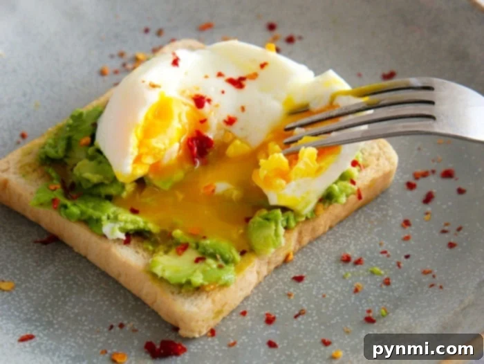 Freshly poached eggs in a bowl, ready to eat.
