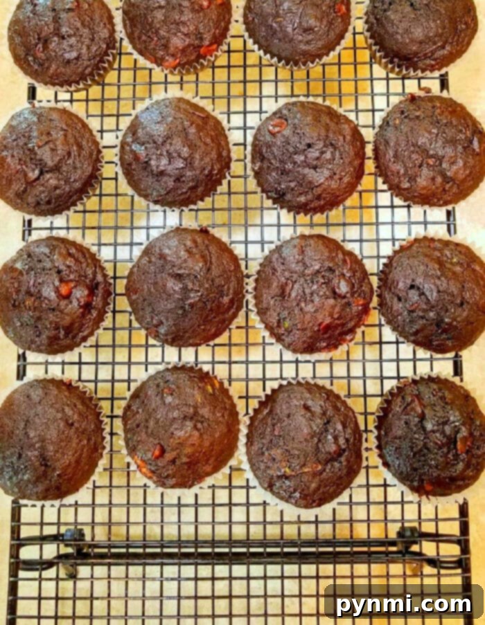 Delicious Zucchini Chocolate Banana Muffins cooling on a wire rack