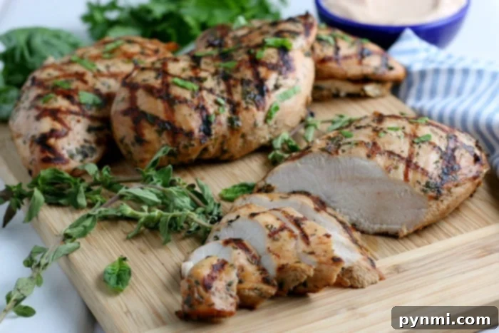 Zesty Lemon Pepper Chicken Marinade 6 Easy chicken marinade recipe shown with a bowl of zesty lemon pepper and herbs next to raw chicken pieces, ready for marination.