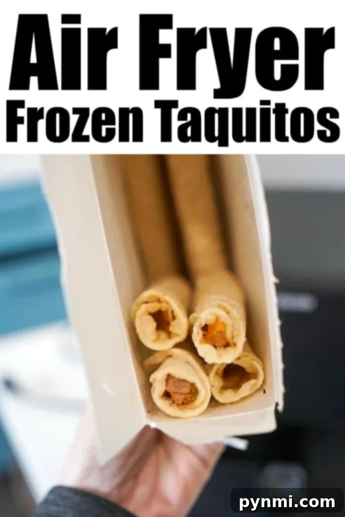 Crispy golden-brown taquitos in an air fryer basket, ready to be served. A perfect example of how delicious frozen taquitos can be when air-fried.