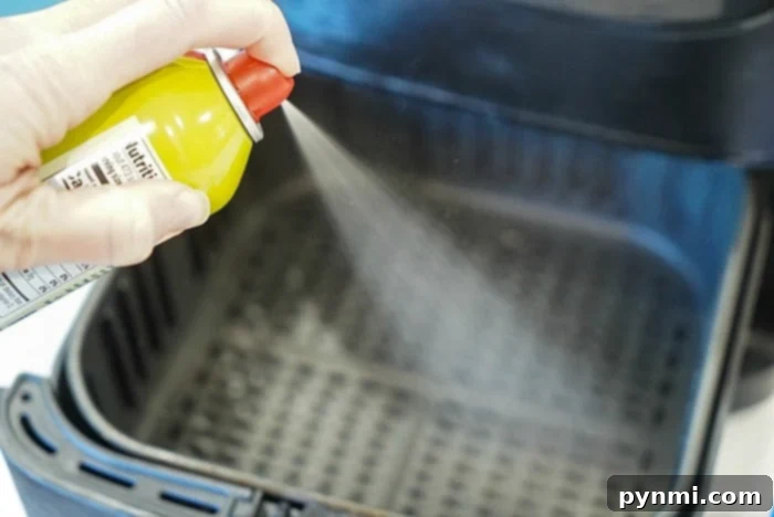 Perfect Air Fryer Frozen Biscuits 5 A bottle of air fryer safe non-stick cooking spray, essential for preventing sticking.