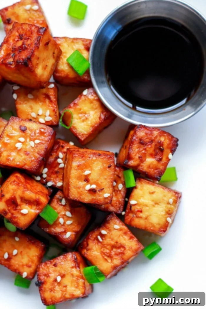 Close-up of crispy air fryer tofu bites in a serving bowl, ready to eat