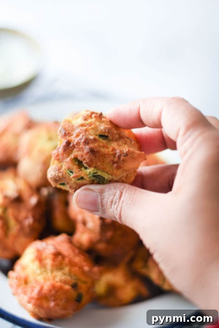 A close-up of freshly air-fried hushpuppies from scratch, perfectly golden and inviting.