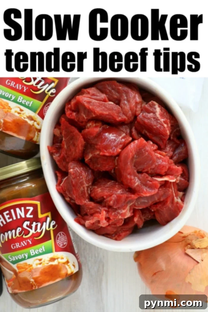 Crockpot beef tips simmering in a rich, dark gravy