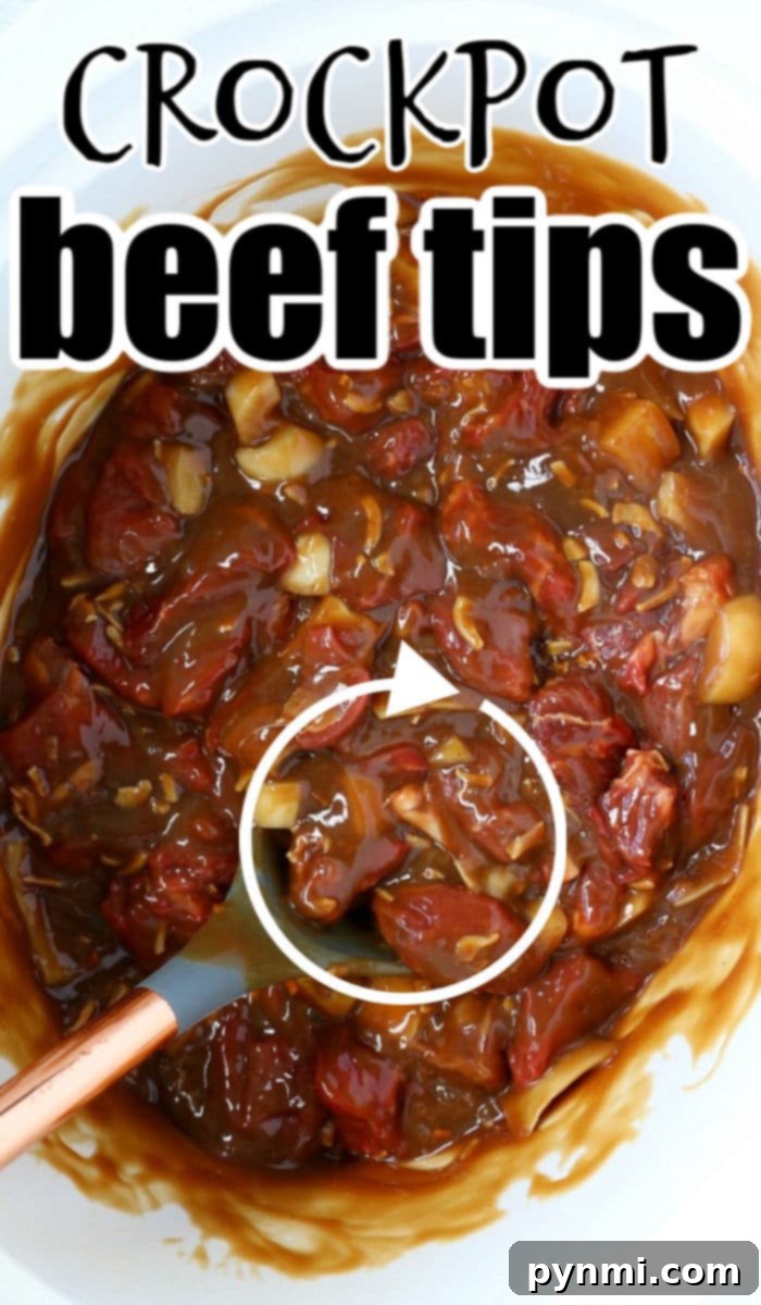 Beef tips and gravy served in a bowl with a side of mashed potatoes