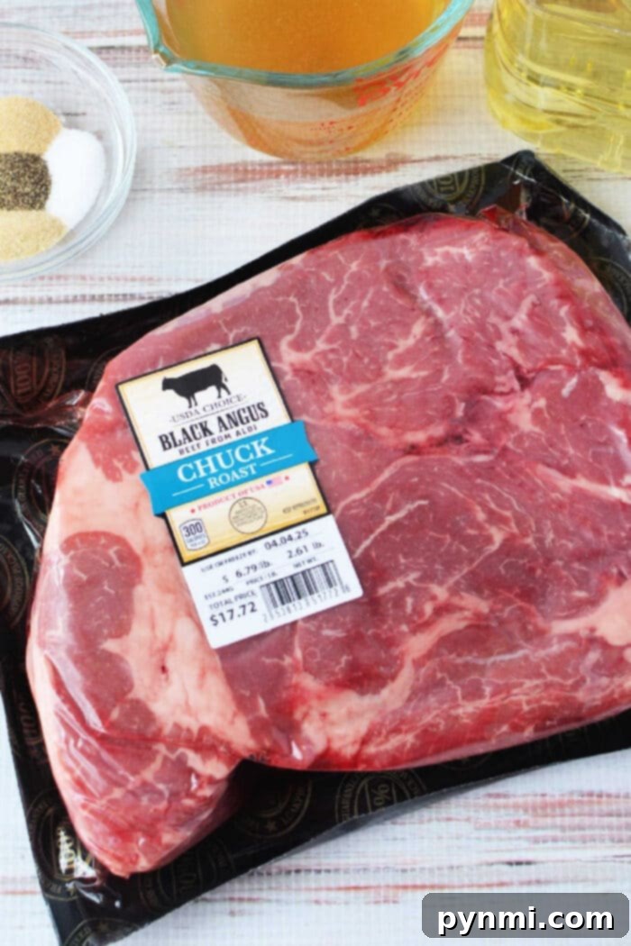 Packaged Black Angus chuck roast on a table with broth, oil, and seasoning bowls nearby—perfect for making savory Mississippi roast in your slow cooker.