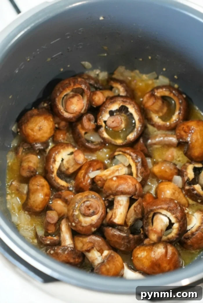 Easy Instant Pot Mushrooms 11 A bowl of delicious pressure cooker mushrooms, the best way to cook them