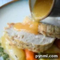 No Thaw No Fuss Instant Pot Frozen Turkey Breast 7 Gravy cascades over sliced roast turkey, carrots, leeks, and thyme, all effortlessly prepared from an instant pot frozen turkey breast.