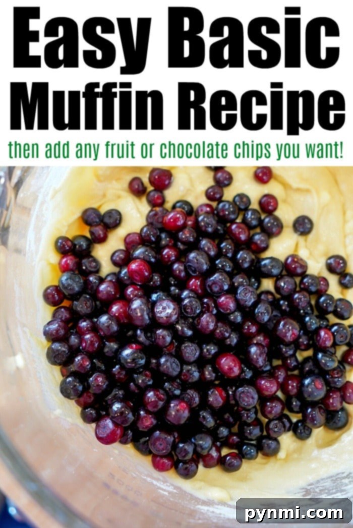 Delicious freshly baked muffins with a golden-brown top and a hint of fruit, sitting on a cooling rack, epitomizing a perfect basic muffin recipe.