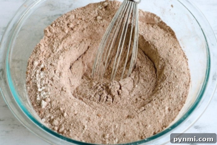 A bag of homemade cake mix on a rustic wooden surface, highlighting the natural ingredients.