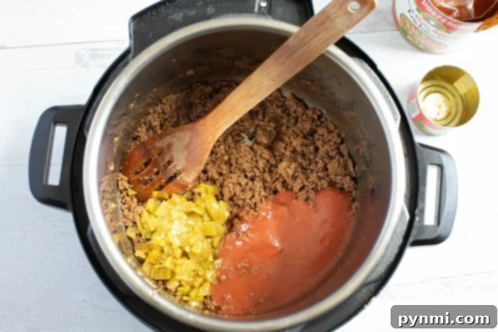 Close-up of ground beef seasoned and ready to be used as enchilada filling.