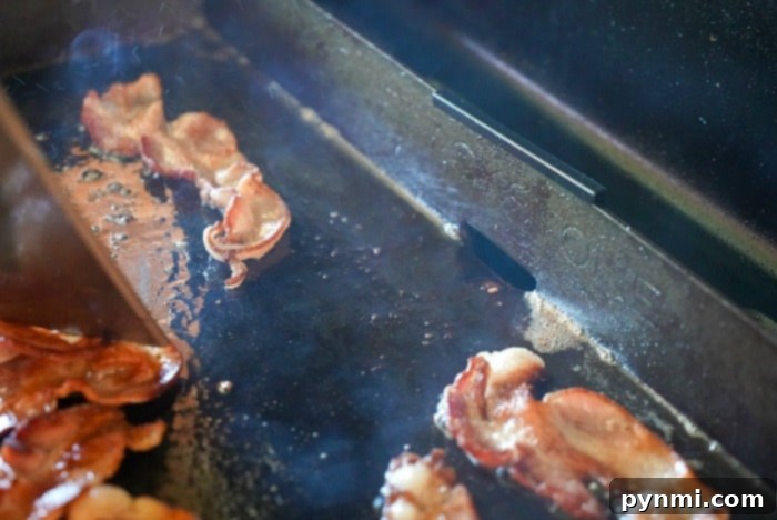 blackstone griddle being scraped clean after cooking