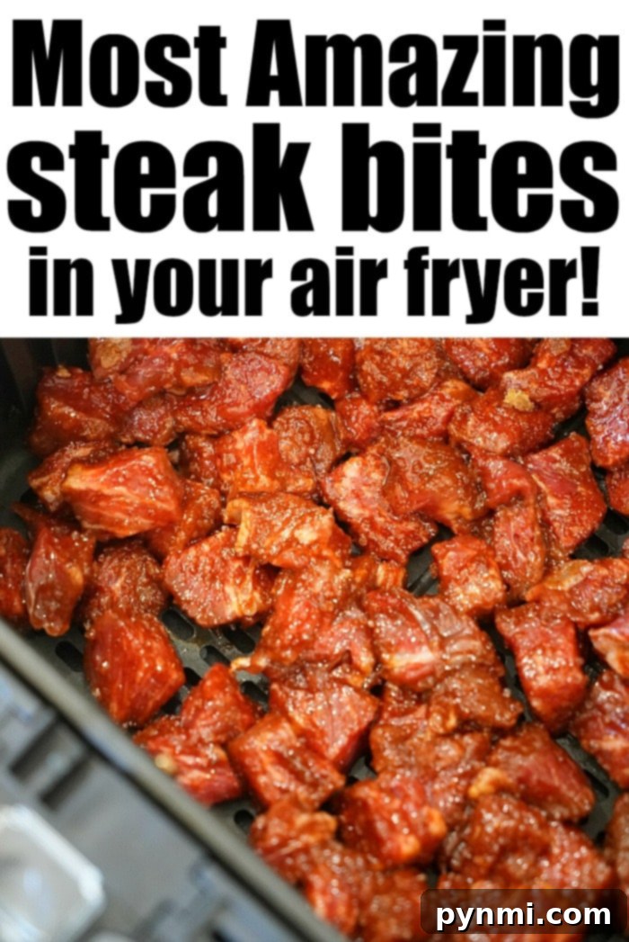 Juicy Air Fryer Steak Bites in Minutes 5 Perfectly cooked steak in an air fryer basket, showing off the delicious crust.