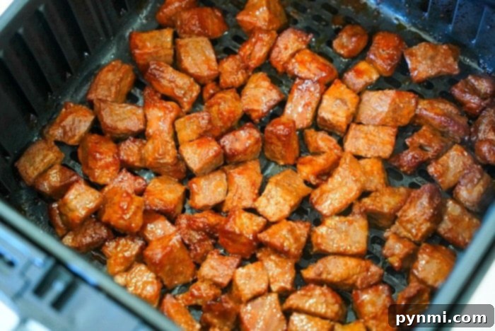 Juicy Air Fryer Steak Bites in Minutes 9 The best air fryer steak bites served in a bowl.