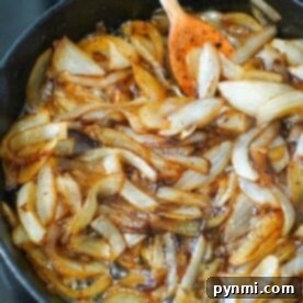 The Ultimate Caramelized Onions 8 Caramelized onions with brown sugar on stove simmer nicely in the skillet, stirred gently with a wooden spoon.