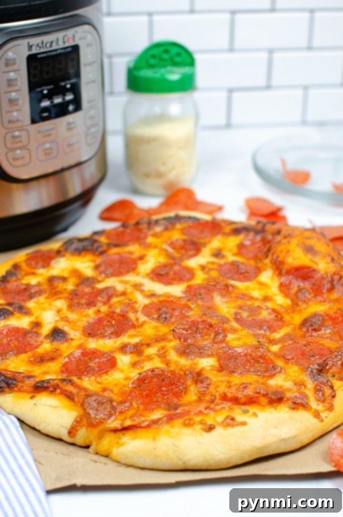 Fluffy Dough Every Time: Your Proofing Guide 7 Pizza dough actively rising in an Instant Pot, covered with a lid to trap warmth for quick proofing.