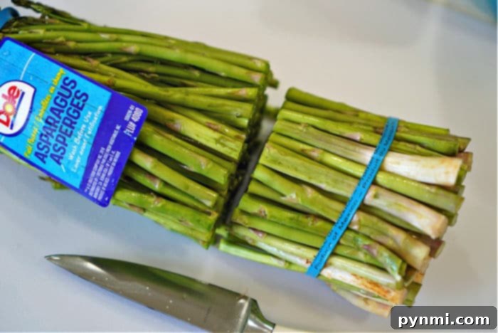 Ninja Foodi Air Fryer Asparagus: Quick & Crispy 5 Fresh, vibrant green asparagus spears, perfectly trimmed and ready for cooking.
