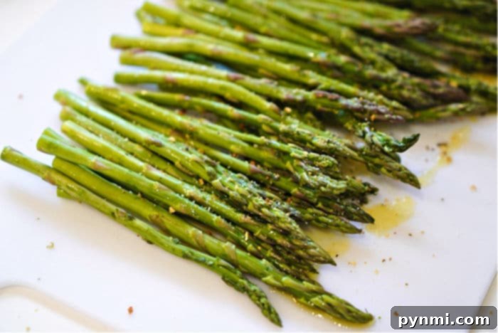 Ninja Foodi Air Fryer Asparagus: Quick & Crispy 7 A dish of air fryer asparagus, seasoned and ready, showcasing the best asparagus recipe.