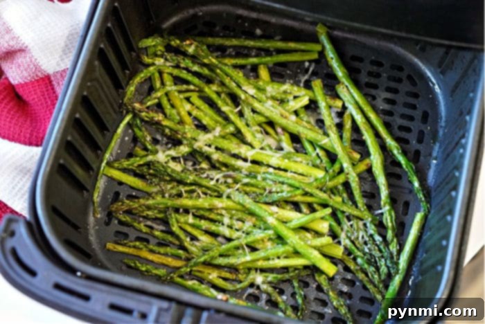Ninja Foodi Air Fryer Asparagus: Quick & Crispy 8 A vibrant side dish of parmesan asparagus, freshly cooked and ready to be enjoyed.