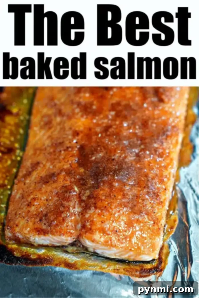 A perfectly baked salmon fillet, boasting a delicious spice crust, rests on a foil-lined baking sheet, signifying the successful completion of the best baked salmon recipe.