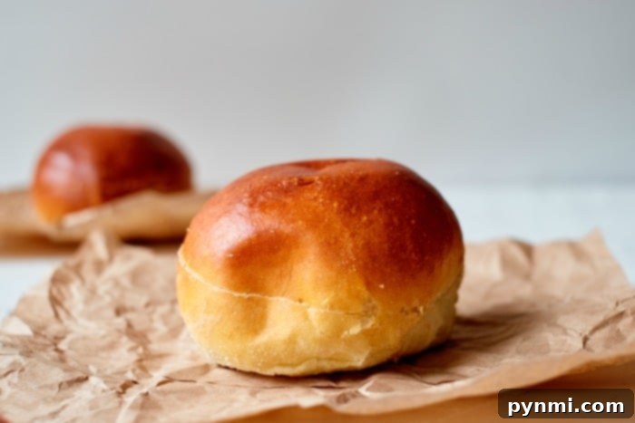 A stack of fresh, soft hamburger buns, ideal for toasting in the air fryer and building delicious chicken patty sandwiches.