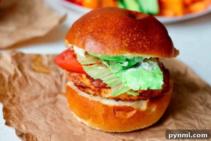 A golden-brown air fryer turkey burger, showing its crispy exterior, ready to be served.
