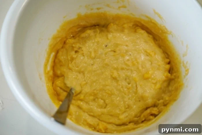 Mayonnaise Magic Banana Bread 5 Lush, thick banana bread batter, ready for baking, showcasing its rich texture before being poured into a loaf pan.
