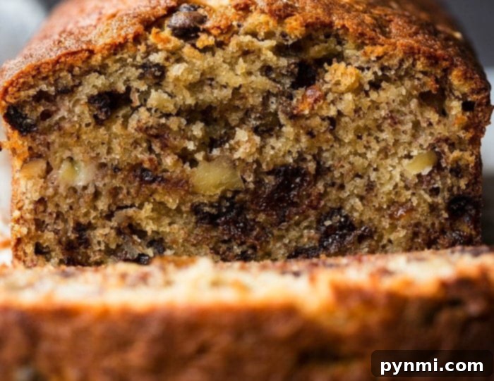 Mayonnaise Magic Banana Bread 6 Freshly baked banana bread with mayonnaise, sliced and ready to be served, revealing its moist and tender interior.