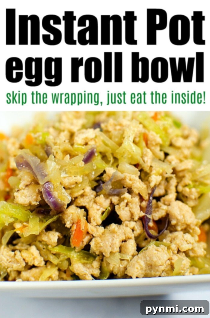 Speedy Instant Pot Egg Roll Bowls 7 A large Instant Pot filled with the freshly cooked and mixed Instant Pot Egg Roll Bowl, garnished with green onions and sesame seeds, ready to be served.
