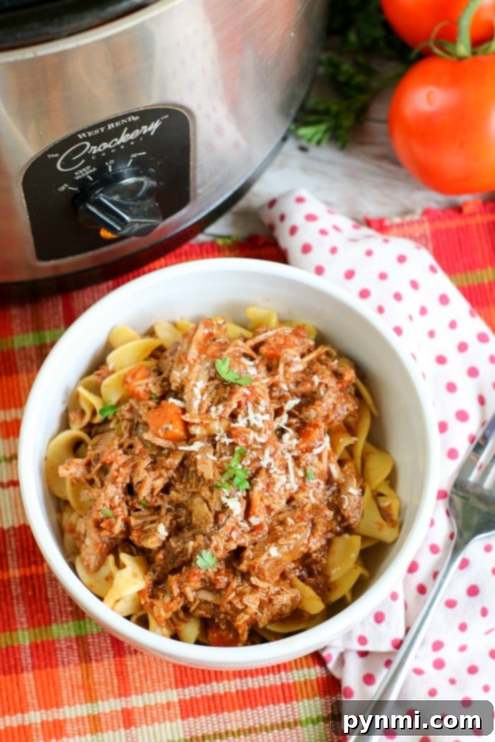 Effortless Slow Cooker Sunday Sauce 8 Slow Cooker Spaghetti Sauce plated with pasta and herbs
