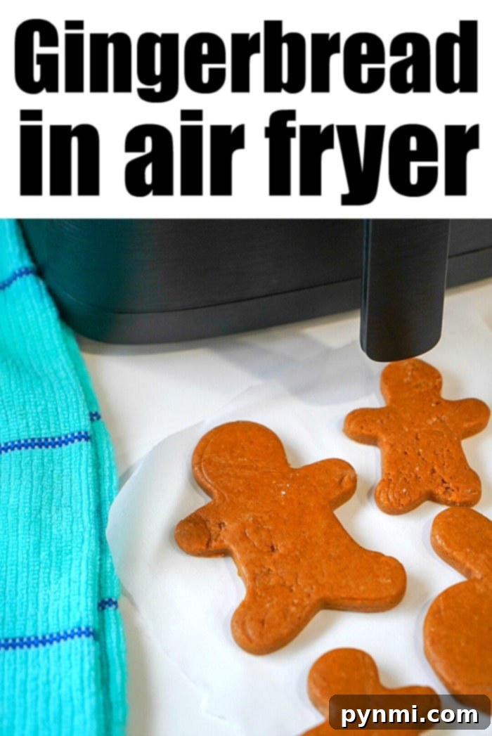 Cake Mix Hack for Air Fryer Gingerbread Cookies 7 A close-up view of gingerbread cookies cooking in an air fryer basket, showing their developing golden-brown crust.